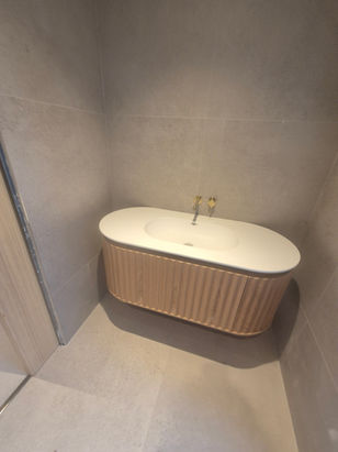 Luxury bathroom renovation with modern tiling and high-end fixtures
