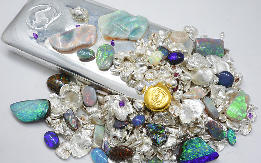 Silver and gold bar with presious metal grain and loose opal and gemstones