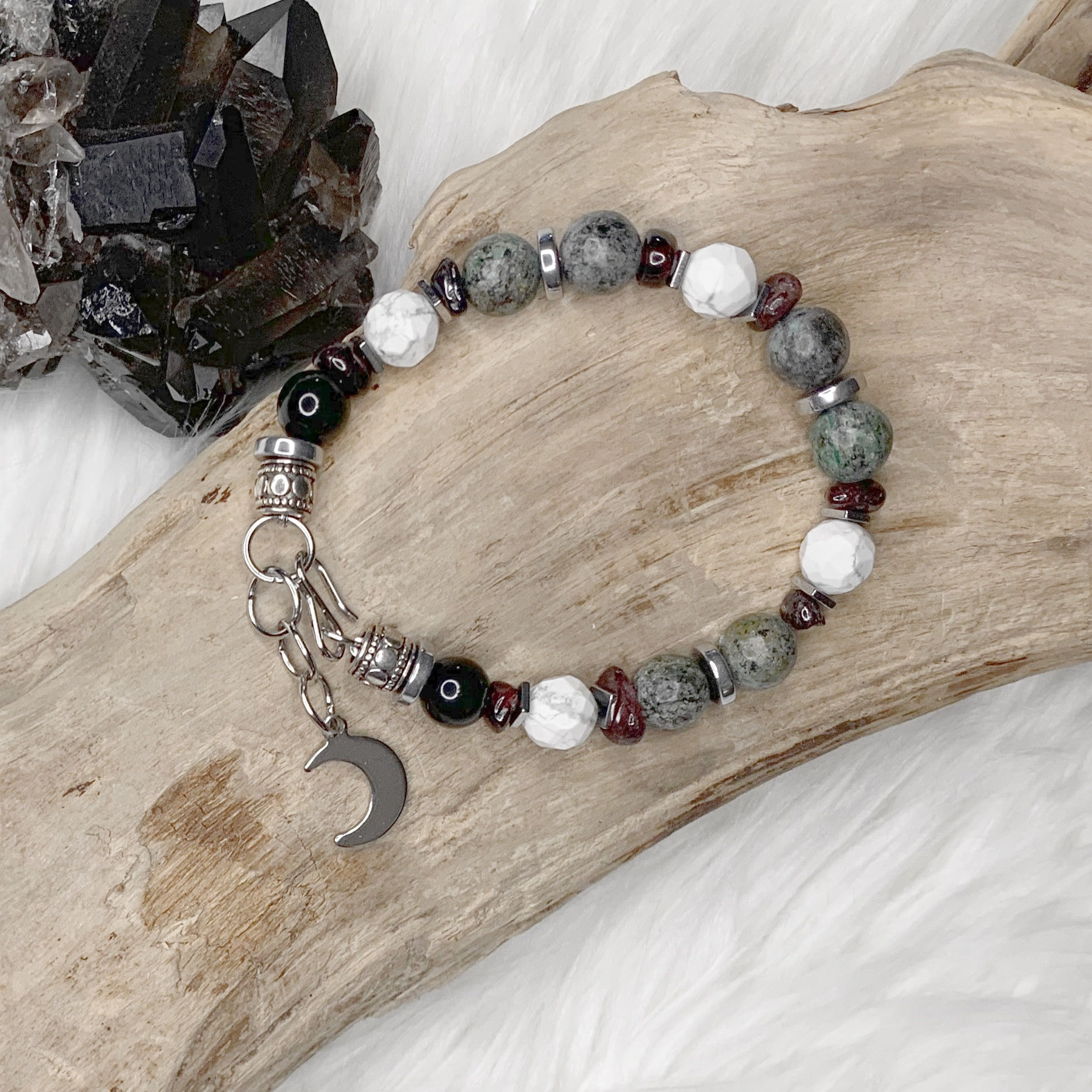B154. African Turquoise, Black Obsidian, Garnet, Hematite, and Howlite Bracelet