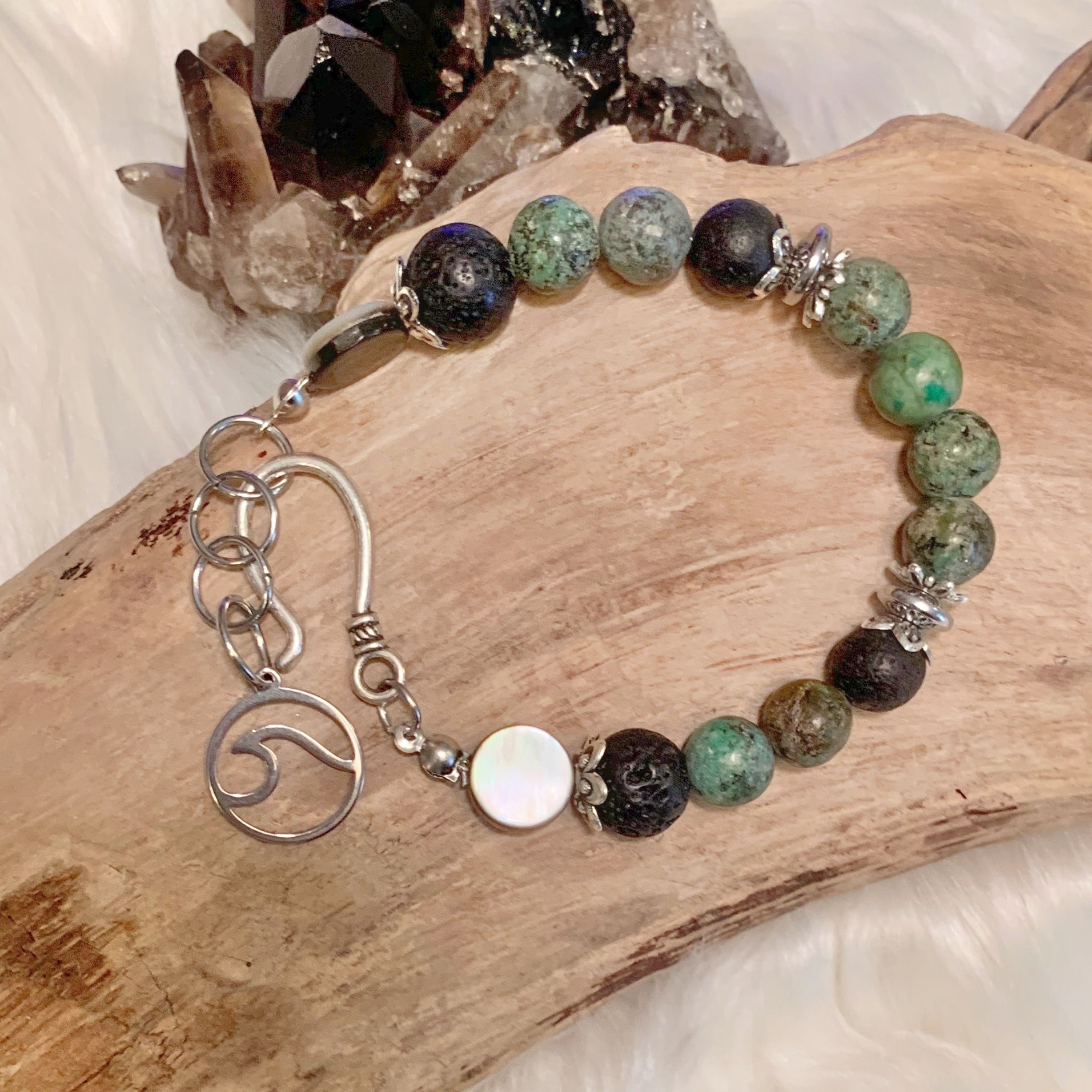 B099. African Turquoise, Hematite, Lava Rock, and Shell Bracelet