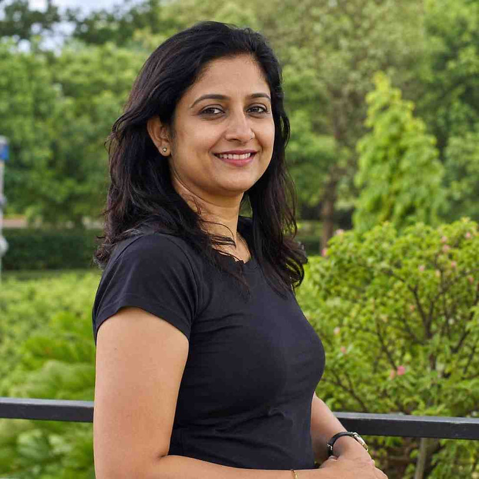 Smiling yoga instructor for online live yoga classes.