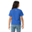 Thumbnail: Young girl wearing blue t-shirt with logo, standing against dark background.