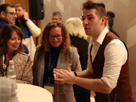 Brenden Trojan perfroming a close up magic for guests