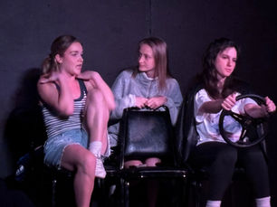 Actors performing a scene during an acting showcase, demonstrating physical connection, voice, and presence in performance