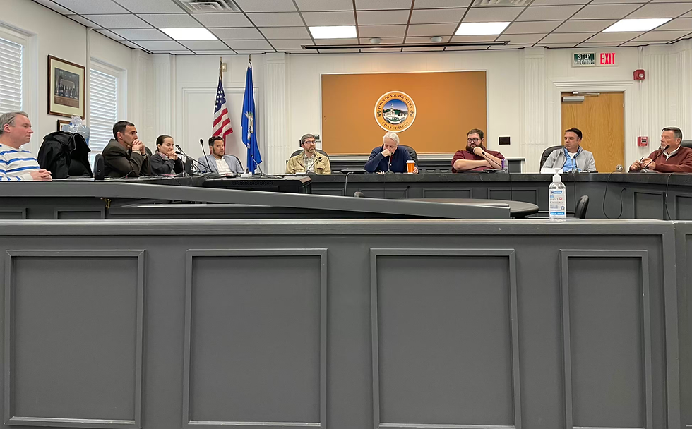 The Ordinance Commission listens to Rivera on speakerphone PHILIP THIBODEAU PHOTO