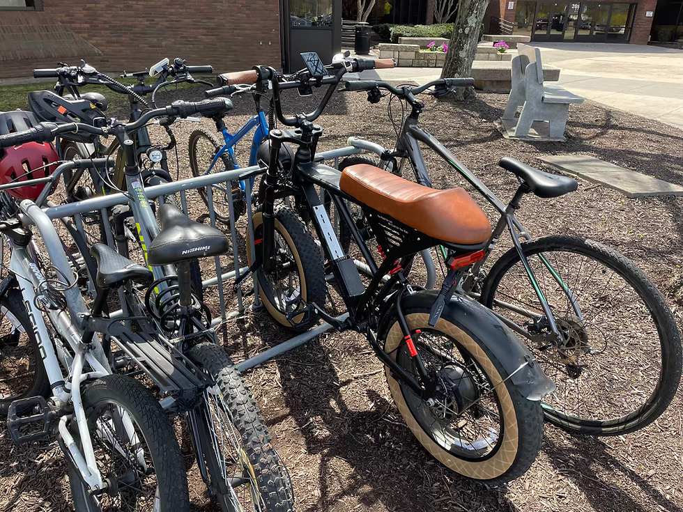 An e-bike parked amid conventional bicycles at Southington High School. PHILIP THIBODEAU PHOTOS