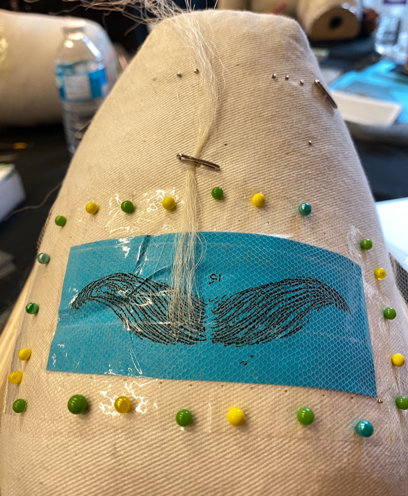 Postiche work on 15 denier lace