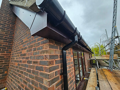 Rosewood Roofline and Black Deepflow guttering 