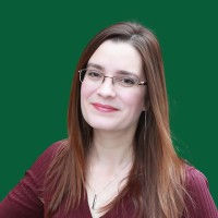 Dr. Allegra Hosford Scheirer with Green BG.jpeg