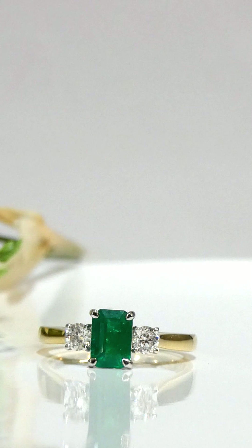 Thumbnail: Emerald Cut Emerald & Diamond Three Stone Ring