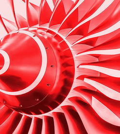 An image of red-coloured fan-blades from an aircraft jet engine