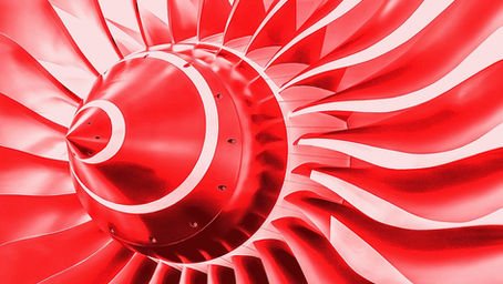 An image of red-coloured fan-blades from an aircraft jet engine