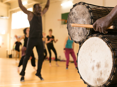 Dance class with instructor and close up of African drums.jpg