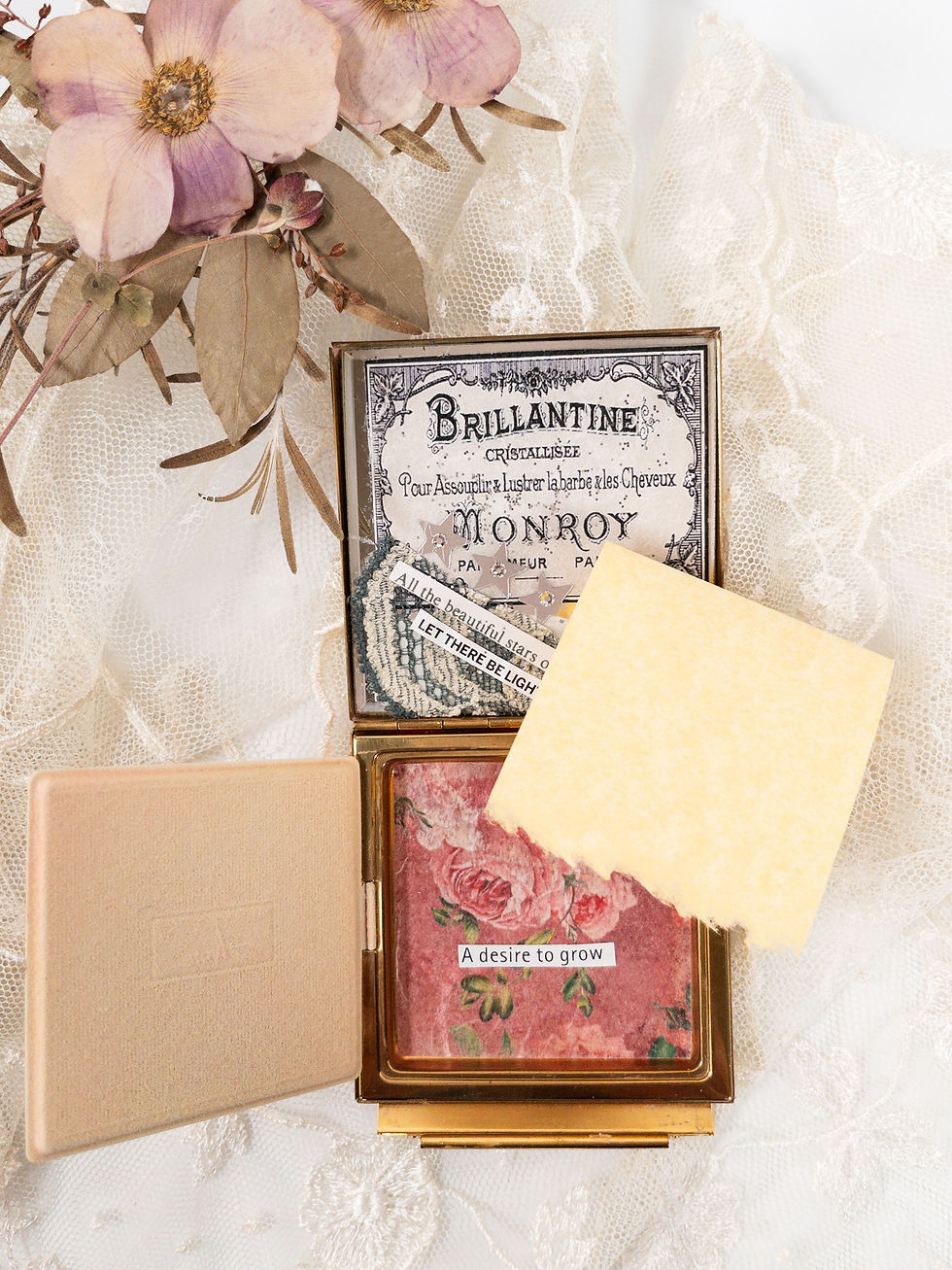 Thumbnail: Vintage brass compact inside view showing floral paper, words "A desire to grow", vintage blank note paper