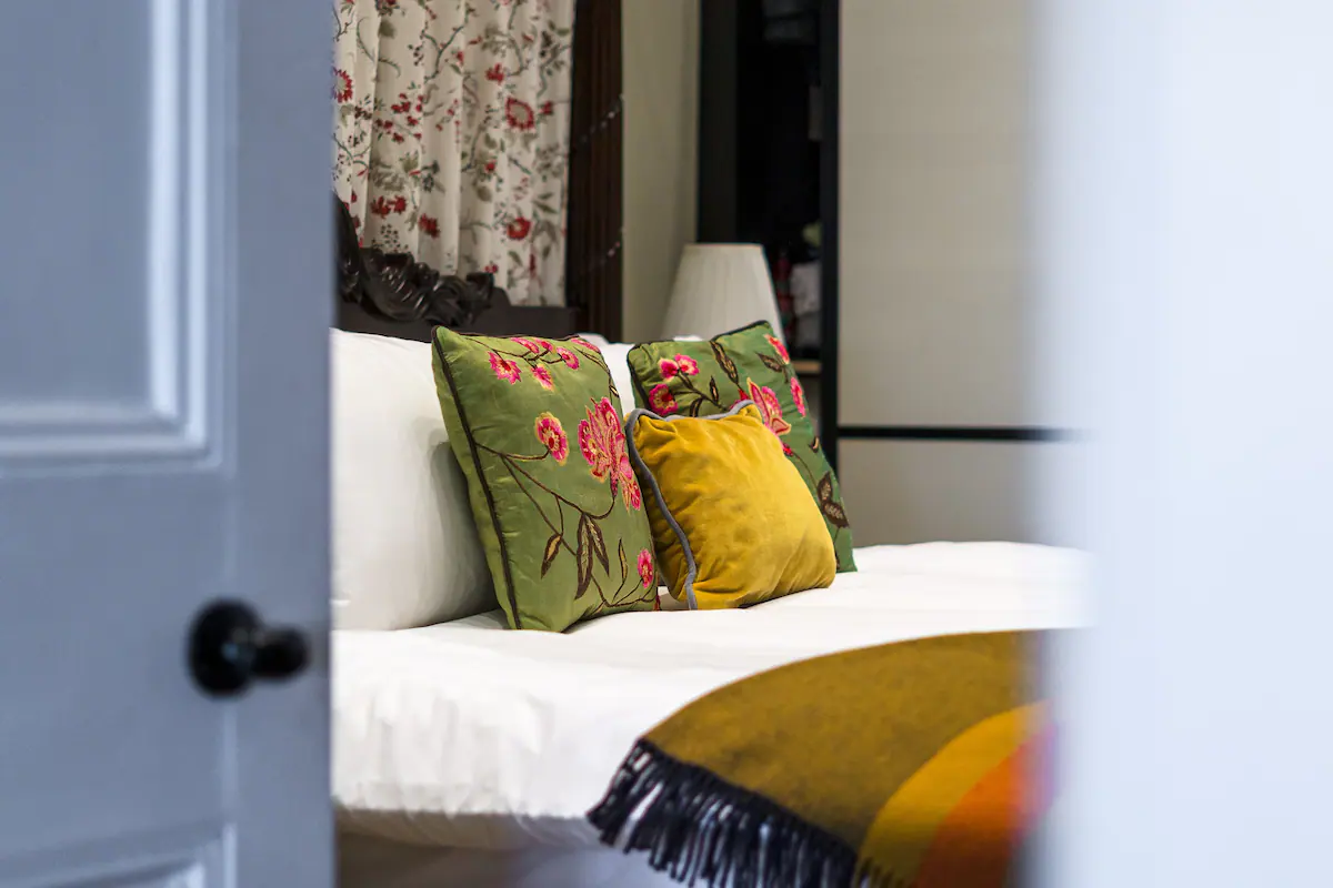 Bedroom at 82 Cathedral Road: A cozy and inviting space featuring a comfortable bed with soft linens, plush pillows, and a stylish headboard