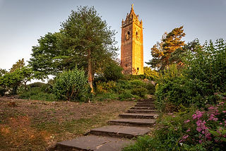 Scenic view of Brandon Hill in the UK, with lush greenery, winding paths, and the iconic Cabot Tower