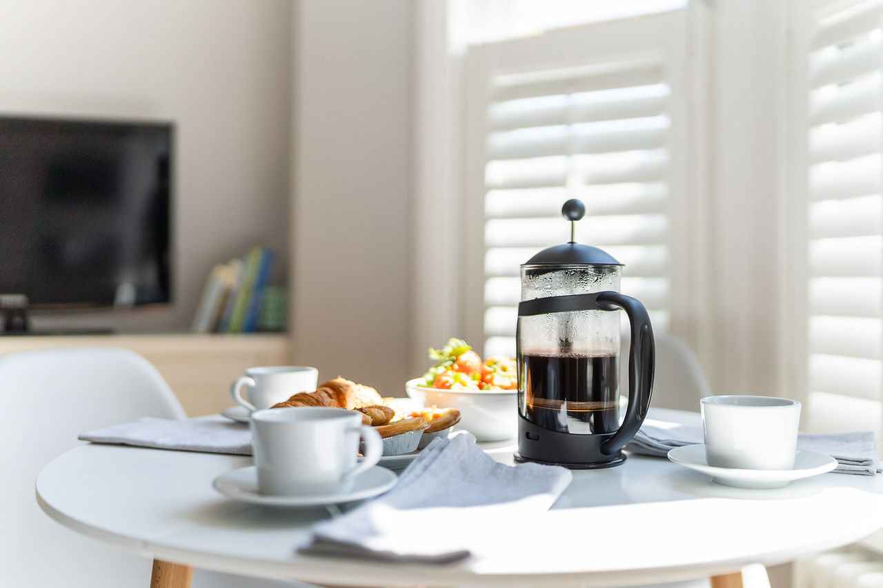 Breakfast spread in accommodation: a cup of fresh coffee