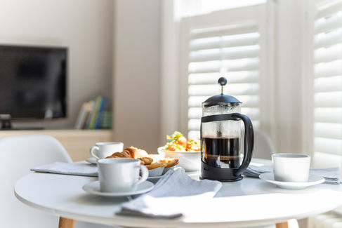 Breakfast spread in accommodation: a cup of fresh coffee