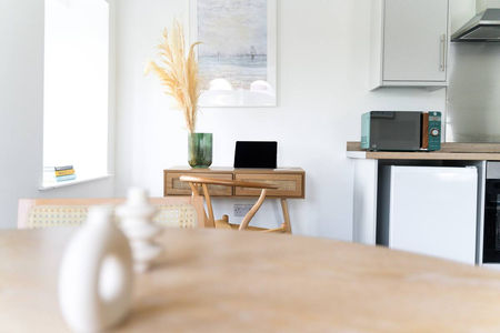 Workspace with a modern design, featuring clean lines, ergonomic furniture, and ample natural light