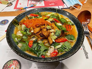 An assortment of vibrant and flavorful dishes from Wagamama in Newport, featuring a selection of Japanese-inspired cuisine