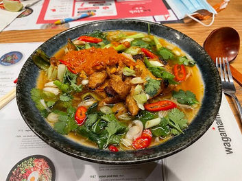 An assortment of vibrant and flavorful dishes from Wagamama in Newport, featuring a selection of Japanese-inspired cuisine