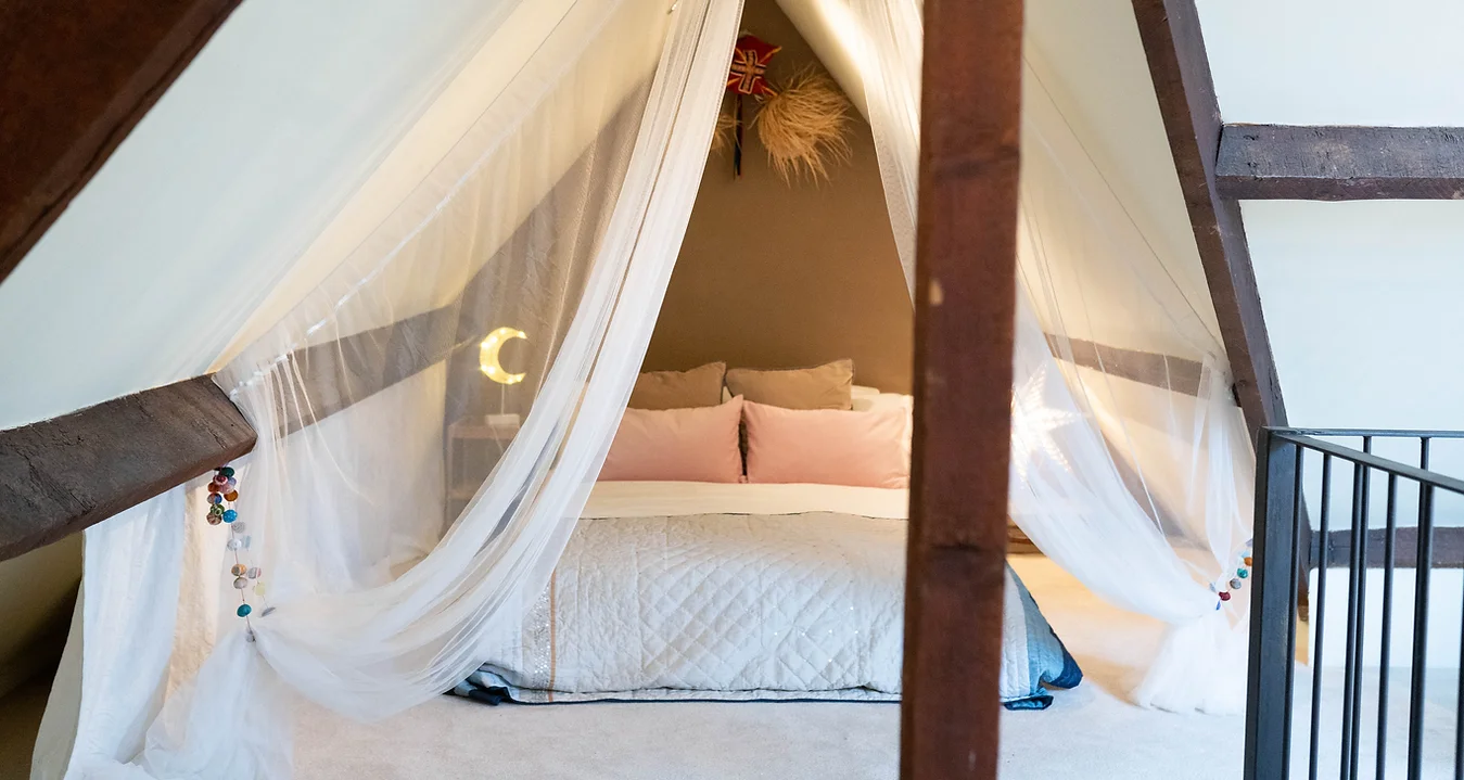 White bedroom with minimalist decor in a Cardiff loft apartment