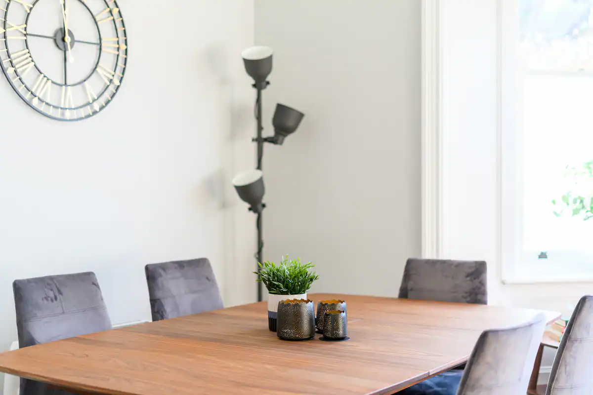 Classic wooden dining table sets the scene for meals and gatherings at Pontcanna Jewel, Cardiff