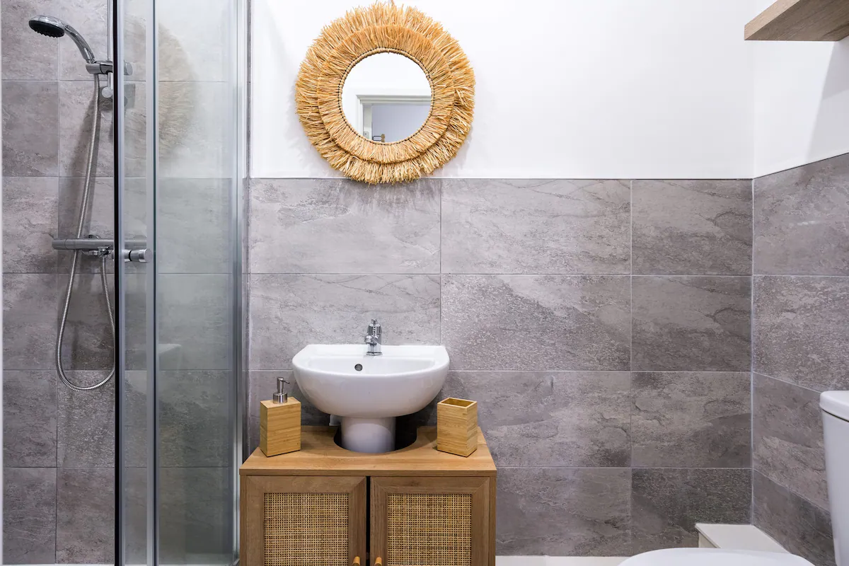Modern bathroom at Ship's Nook apartment, featuring clean lines, contemporary fixtures, and a minimalist design