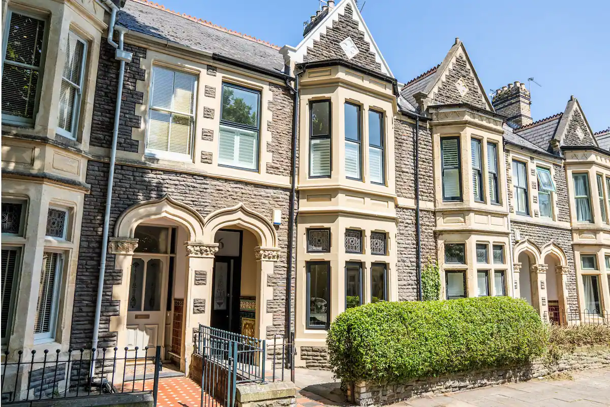 A grand Victorian-era structure adorned with intricate architectural details, including ornate cornices and decorative moldings
