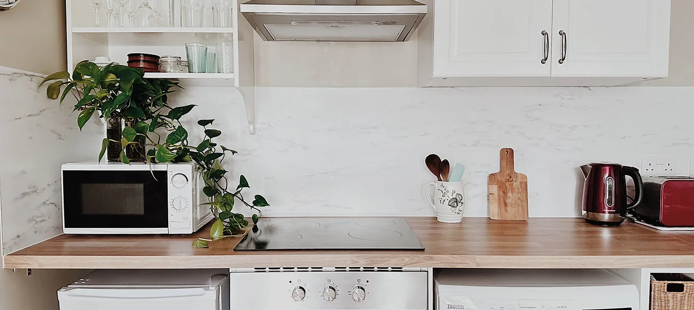 modern kitchen with stainless steel appliances and sleek countertops in a Cardiff loft apartment
