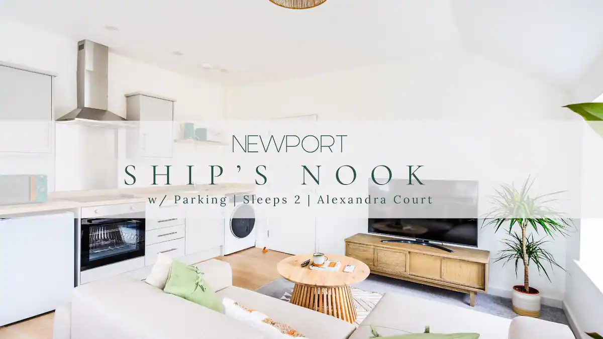Bright and airy living room of Newport Ship's Nook apartment, featuring a white pastel color theme