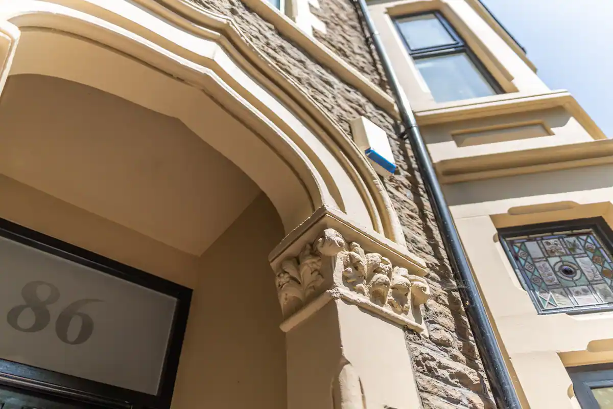 Victorian exterior building: A grand, ornate structure with intricate architectural details typical of the Victorian era, featuring tall windows, decorative moldings