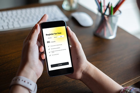 Phone-hand-register-for-free.jpeg