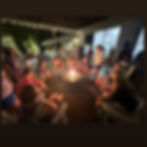 Campers gather on the back porch of Hargis Christian Camp, their faces lit by the glow of the fire pit. As two teens lead with acoustic guitars, the atmosphere fills with worship, stillness, and the presence of God.