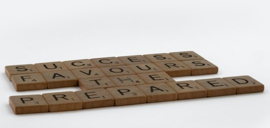 Words spelled out on scrabble tiles