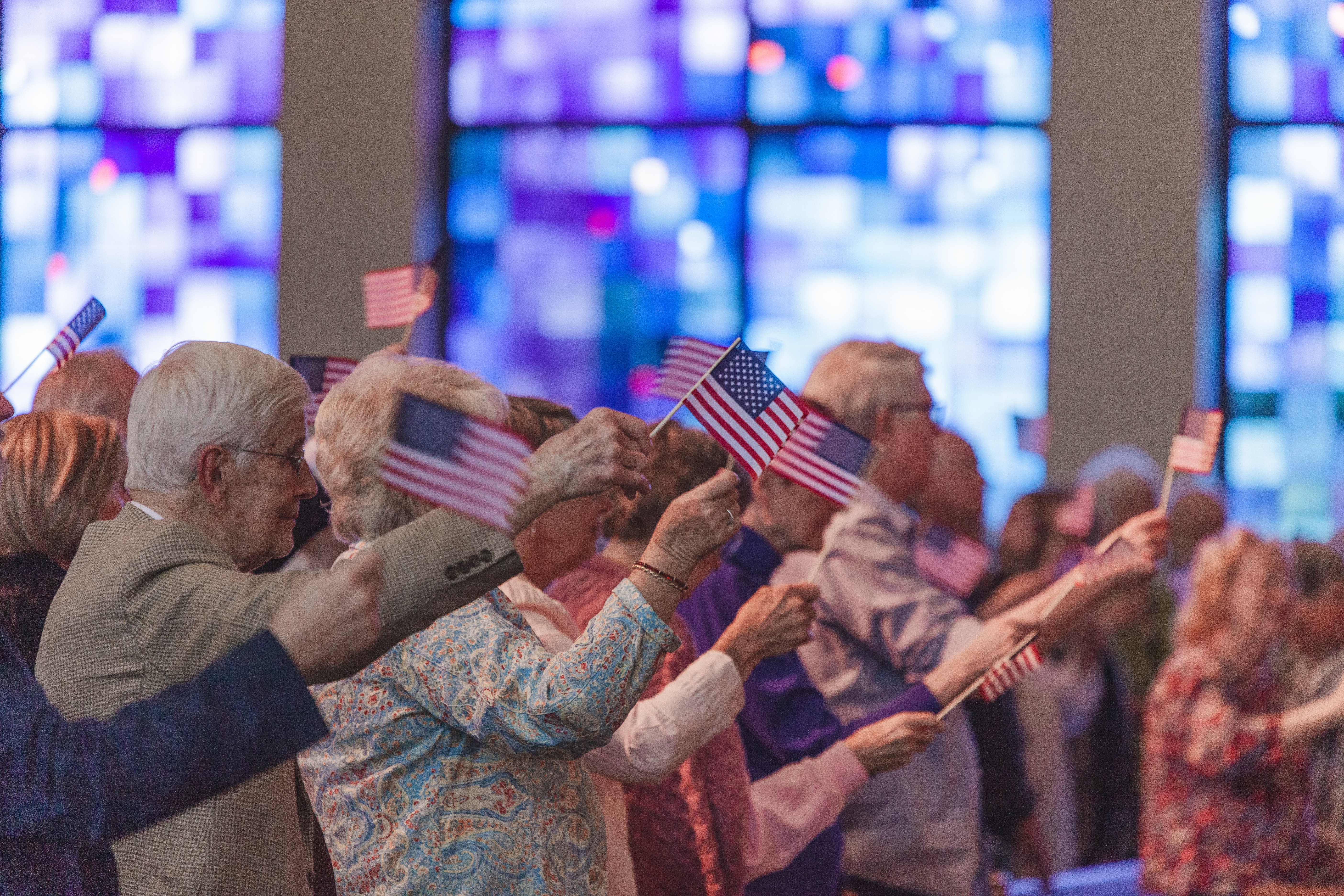 Patriotic flag wavers at a church assembly