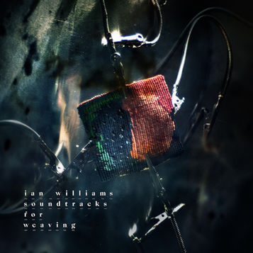 The cover image to Soundtracks For Weaving by Ian Williams, featuring a very small red and blue tapestry held by crocodile clips, on a dark background.