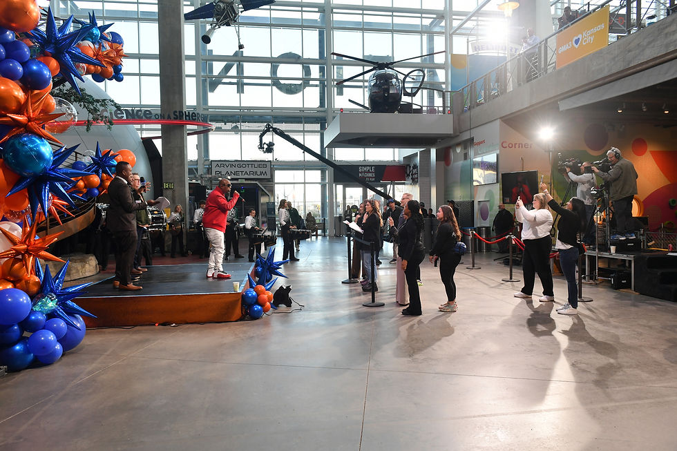 Tech N9ne, Eric Stonestreet, and the CEO of Great Jobs KC present on a stage at a GMA3 event