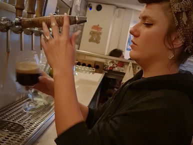 Bartender pouring Black Panthers American Brown Ale at Kælderkold craft beer bar in Barcelona