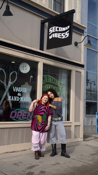 Owners of Second Vibess outside of store