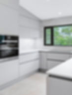 Handleless kitchen with matte black base cabinets, undercounter lighting, and J-pull profile — Valley Stream, NY