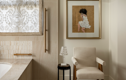 A ensuite bath area with luxurious brass safety bars.