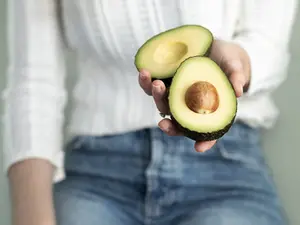 Rachael Robinson holding an avocado