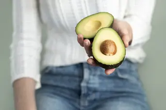 Rachael Robinson holding an avocado