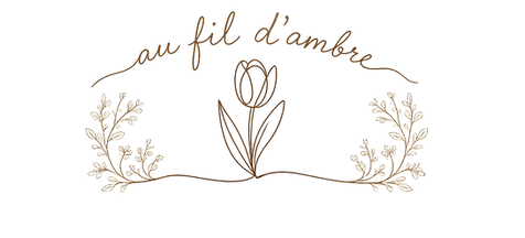 Logo Au fil d'Ambre - broderie et personnalisation artisanale pour bébé
