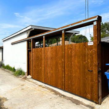 sliding wood gate by A+ Fences in Winnipeg