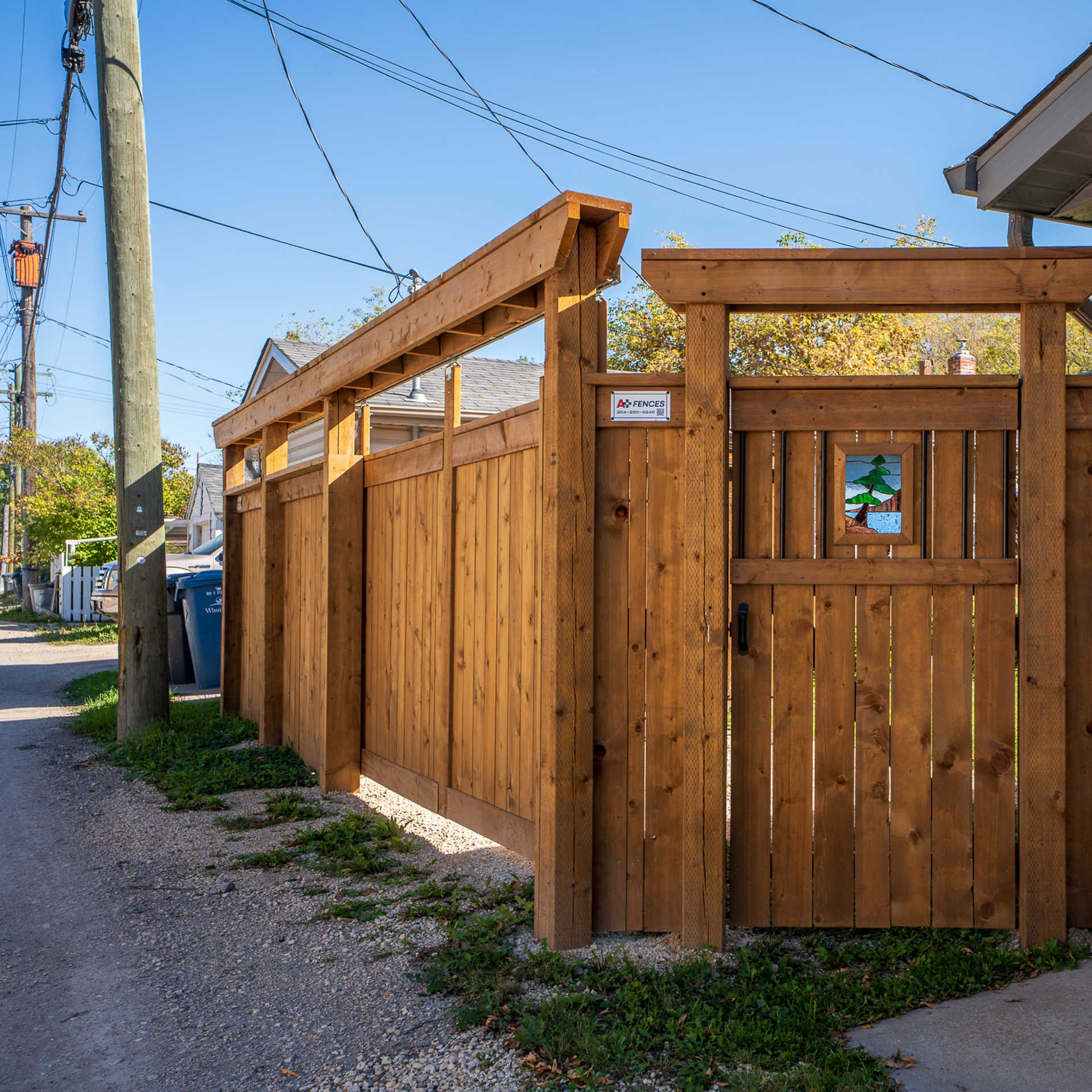 Sliding Gate Installation in Winnipeg Back Lanes by A+ Fences 