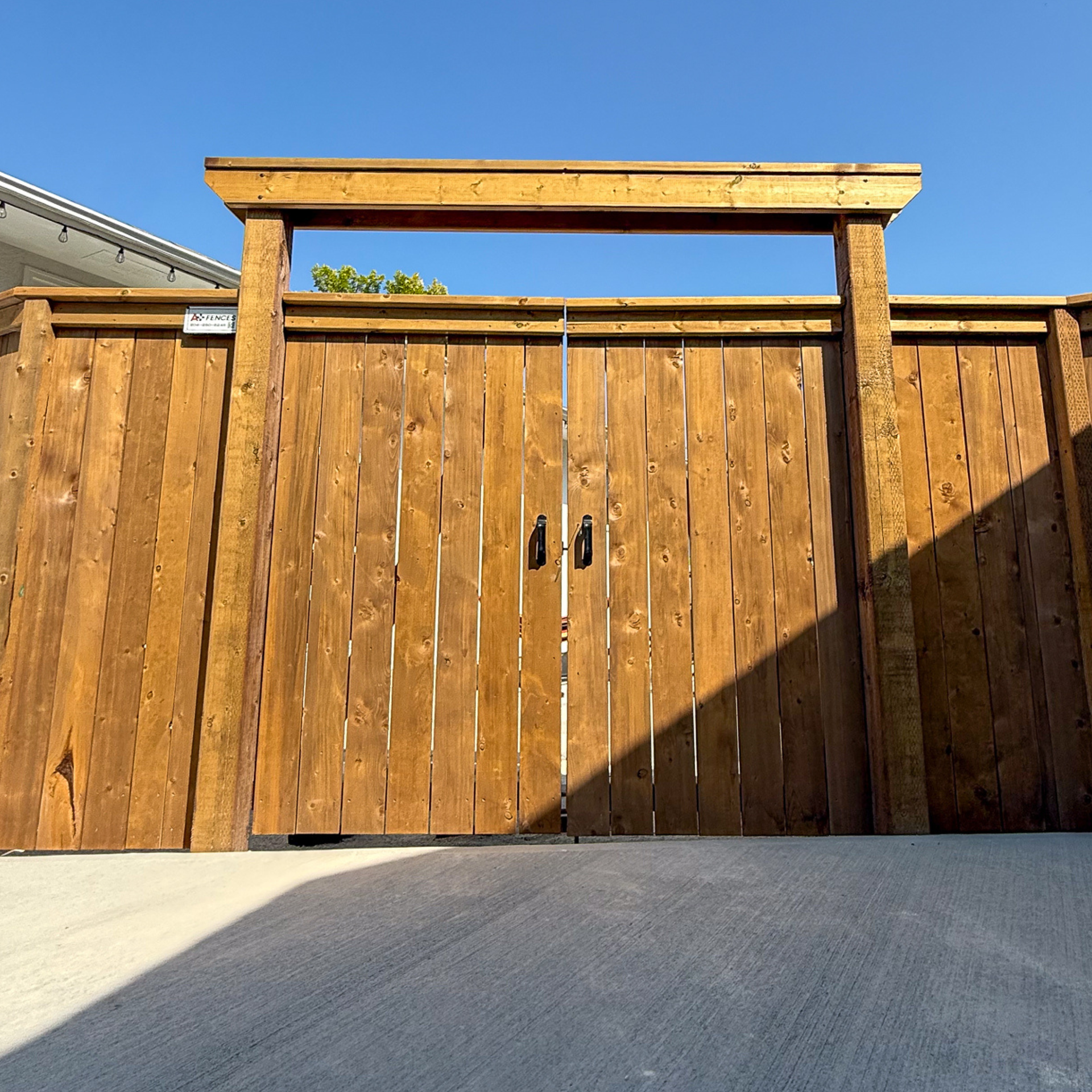 Wood fence by A+ Fences in Winnipeg