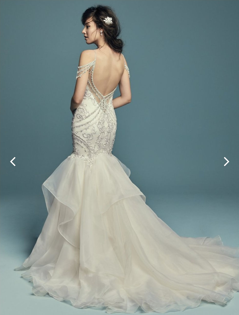 Thumbnail: Glamorous and vintage-inspired, this mermaid wedding dress features a tulle bodi