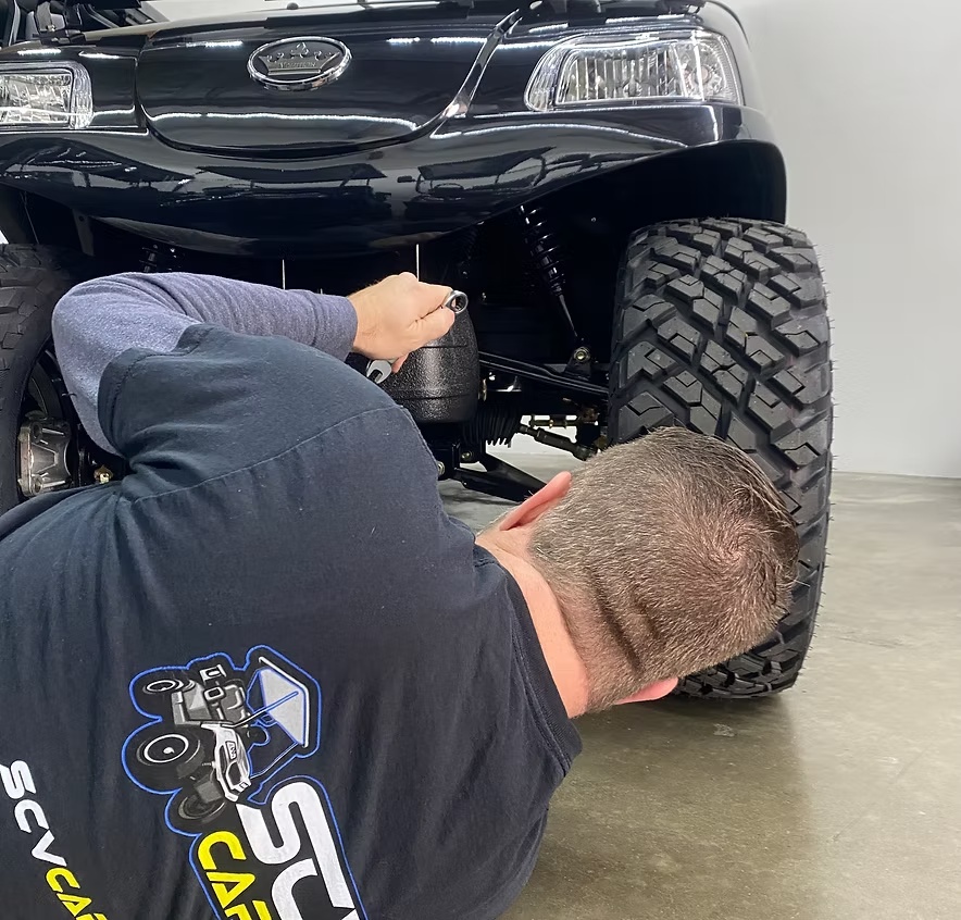 SCV Carts technician servicing a golf cart in the Santa Clarita service department